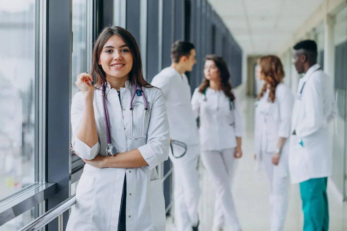 A WCGTX physician reviewing a chart with a colleague