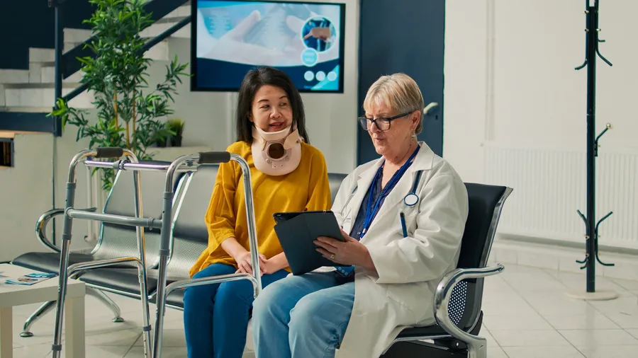 A physician consulting a patient at an urgent care clinic